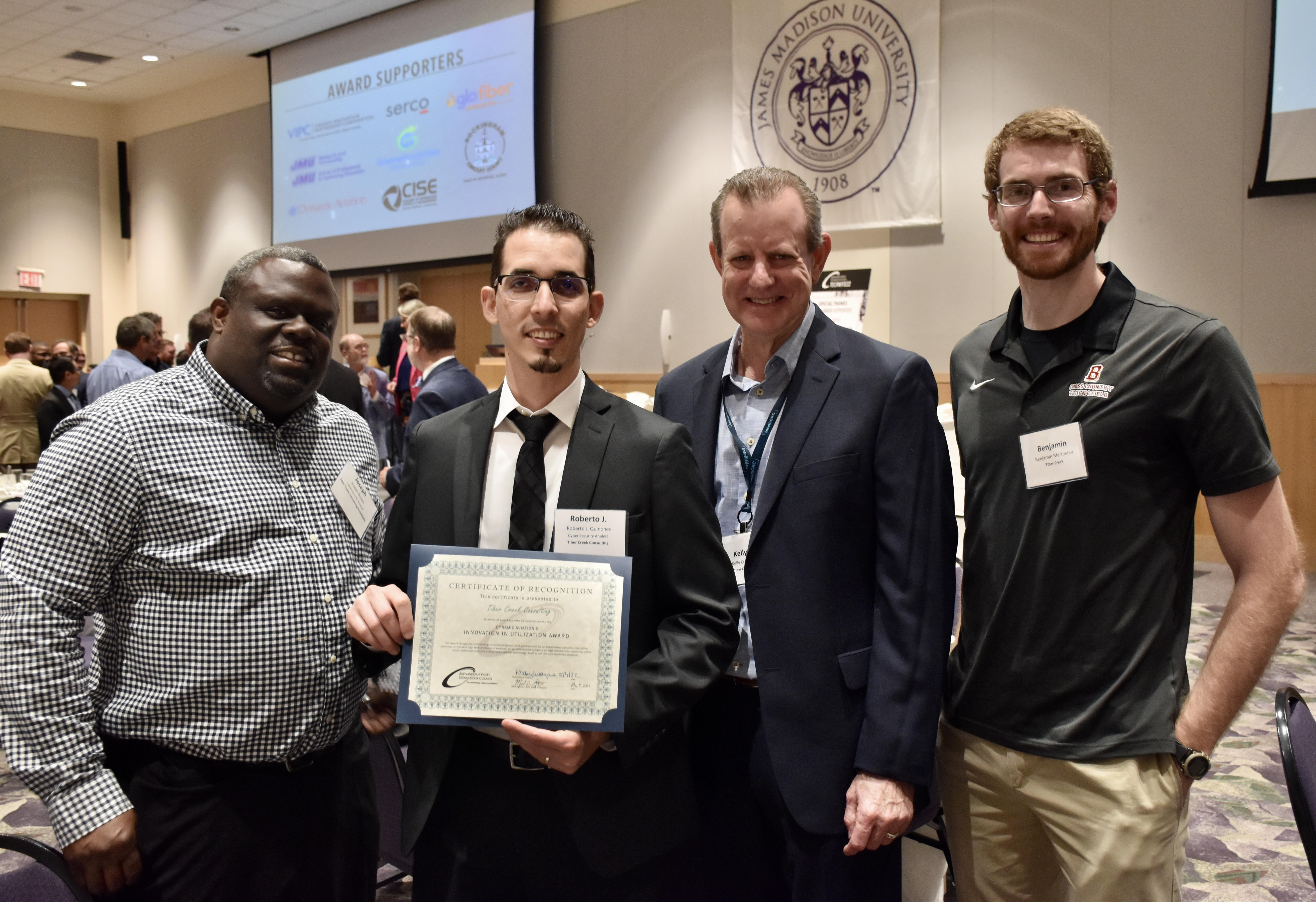 Photo of IntelliGRC team holding award